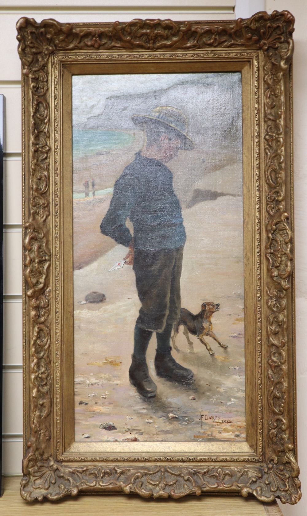 James Frederick Darley (1847-1932), oil on canvas, Boy and dog on the seashore, signed and dated 1886, 50 x 23cm